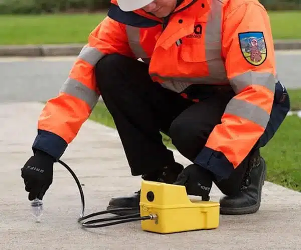 A photograph of the Cable Sniffer being used against a path, to check for faults